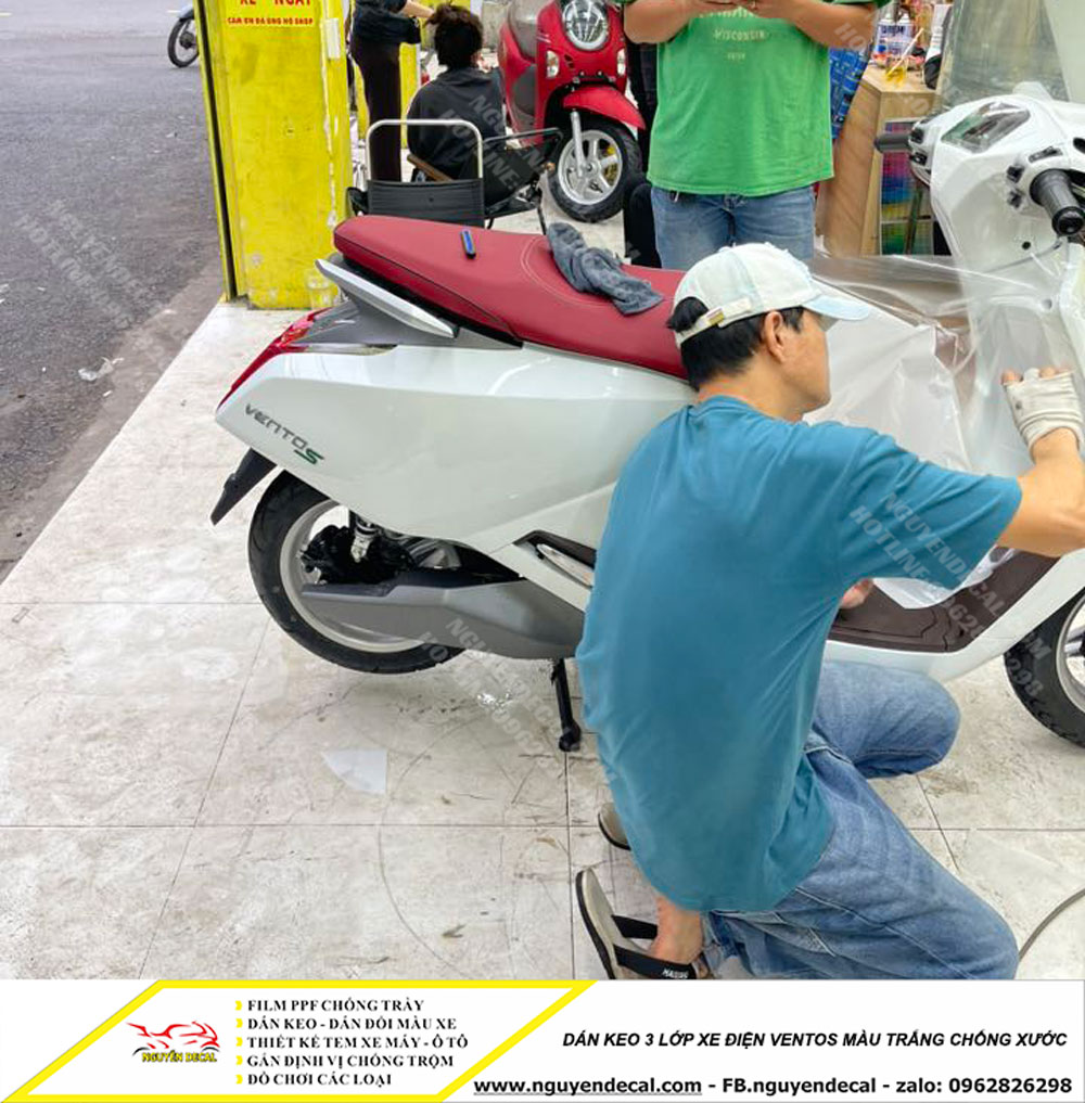 Dán keo 3 lớp xe điện Ventos màu trắng Dán keo 3 lớp xe điện Ventos màu trắng
